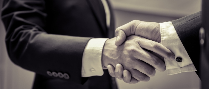 Business people shaking hands, finishing up a meeting,Negotiations were successfully